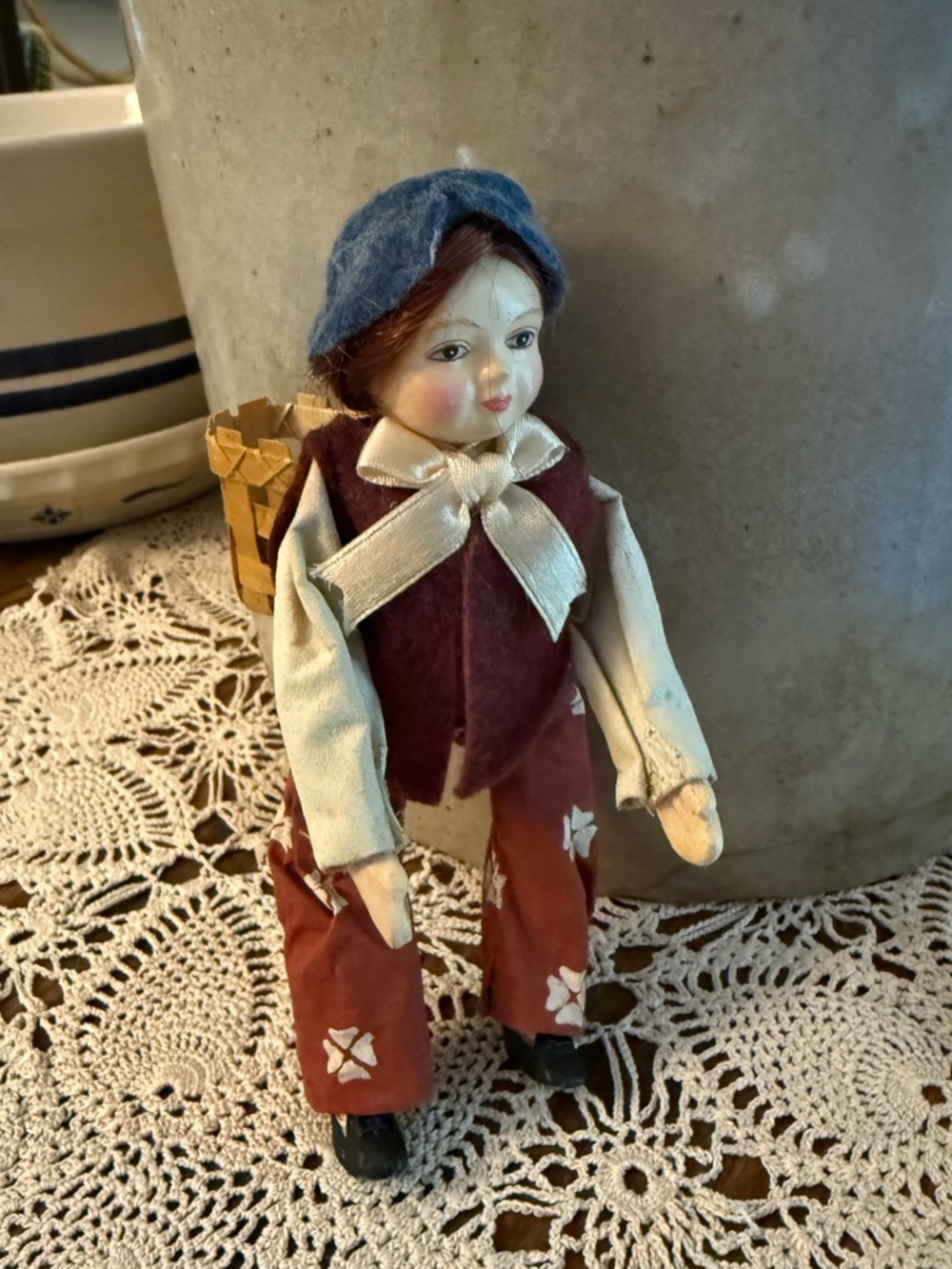 Vintage handcrafted European folk art doll porcelain and paper mache.
